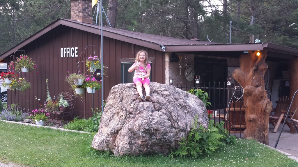 Luna Sits on the Rock in Front of the Office at Patricia Lake Campground.