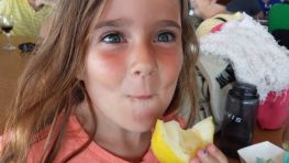 Luna Eating Lemons at St. Ignace Fish Feast.