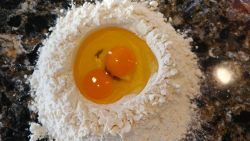 Readying to make pasta. Making Pasta Eggs Flour